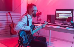 side-view-man-playing-guitar